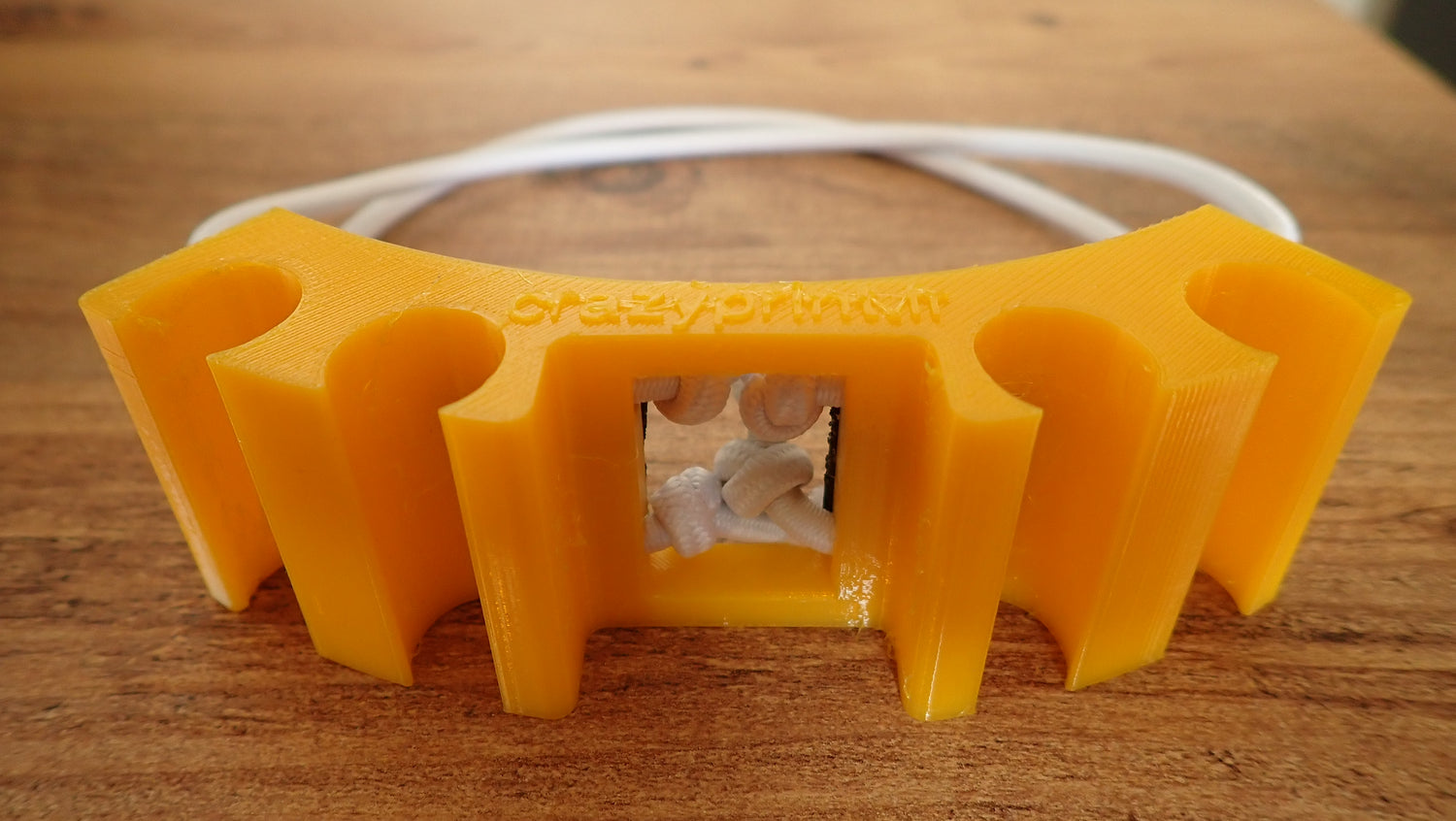 Organisateur flexibles plongée orange TPU bloc vue produit avec tuyaux blancs